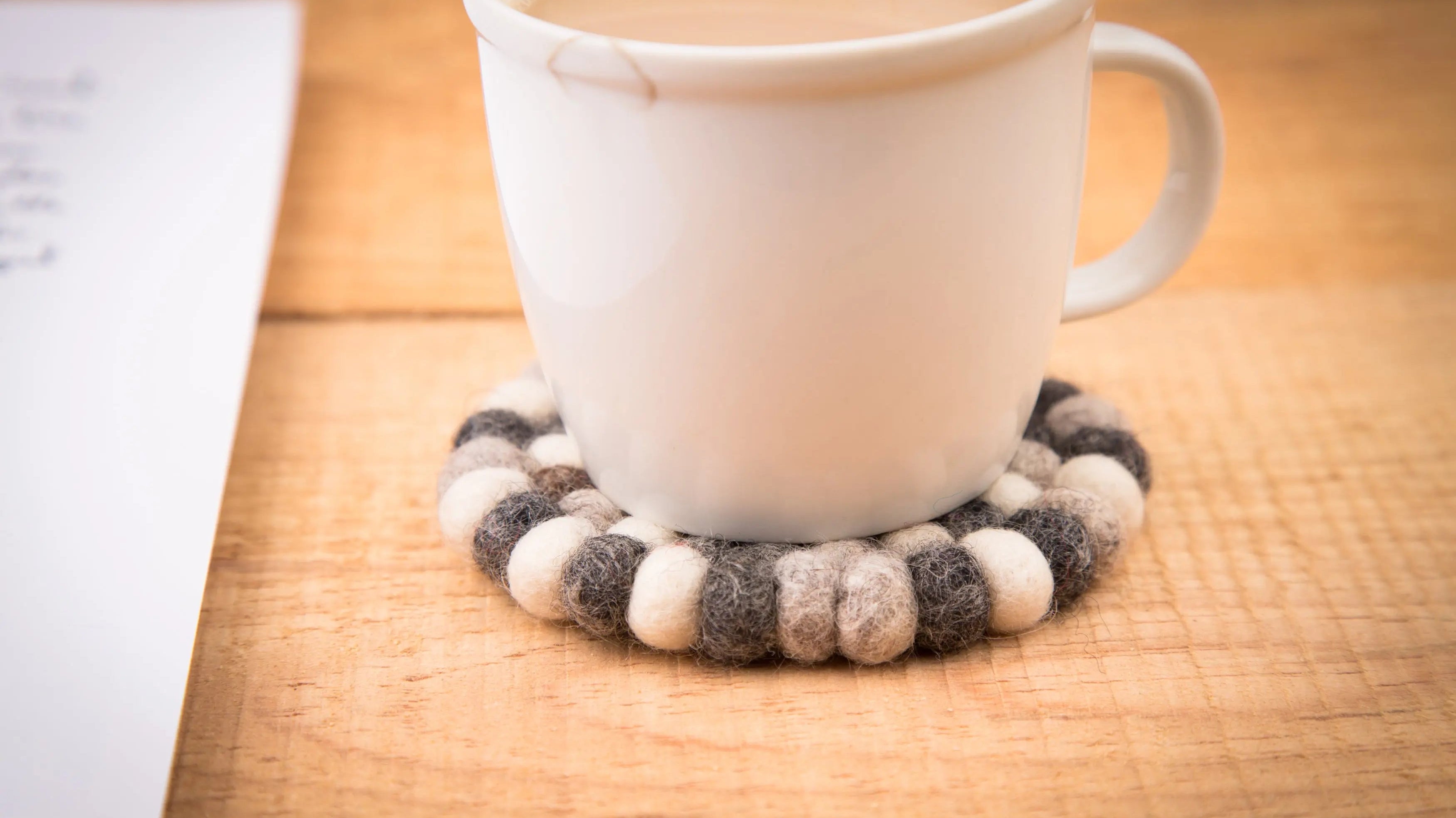 Embrace the Vibrant Beauty of Wholesale Felt Ball Trivets and Coasters from Nepal: A Reseller's Dream! - Best Himalaya