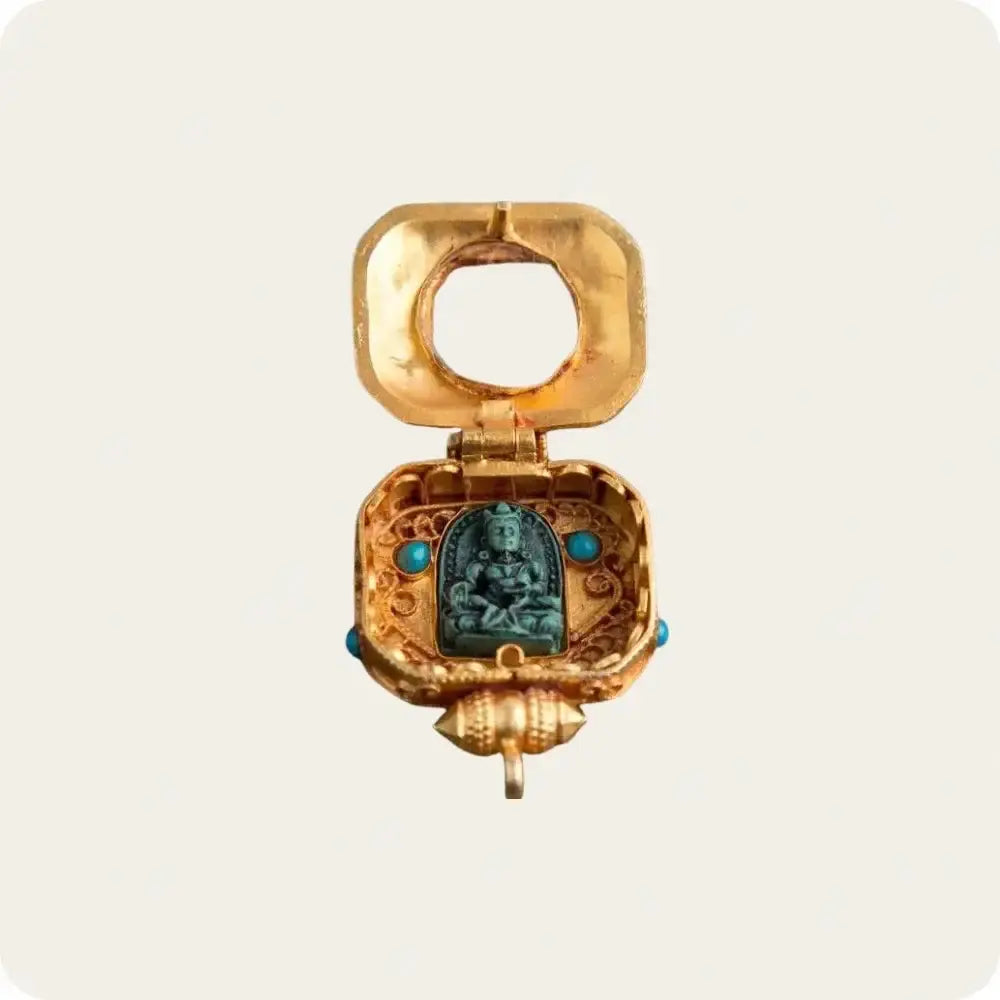 Tibetan Ghau Pendant with intricate design, featuring an open compartment displaying a deity statue inside. Traditional Tibetan jewelry used for spiritual and meditation purposes.