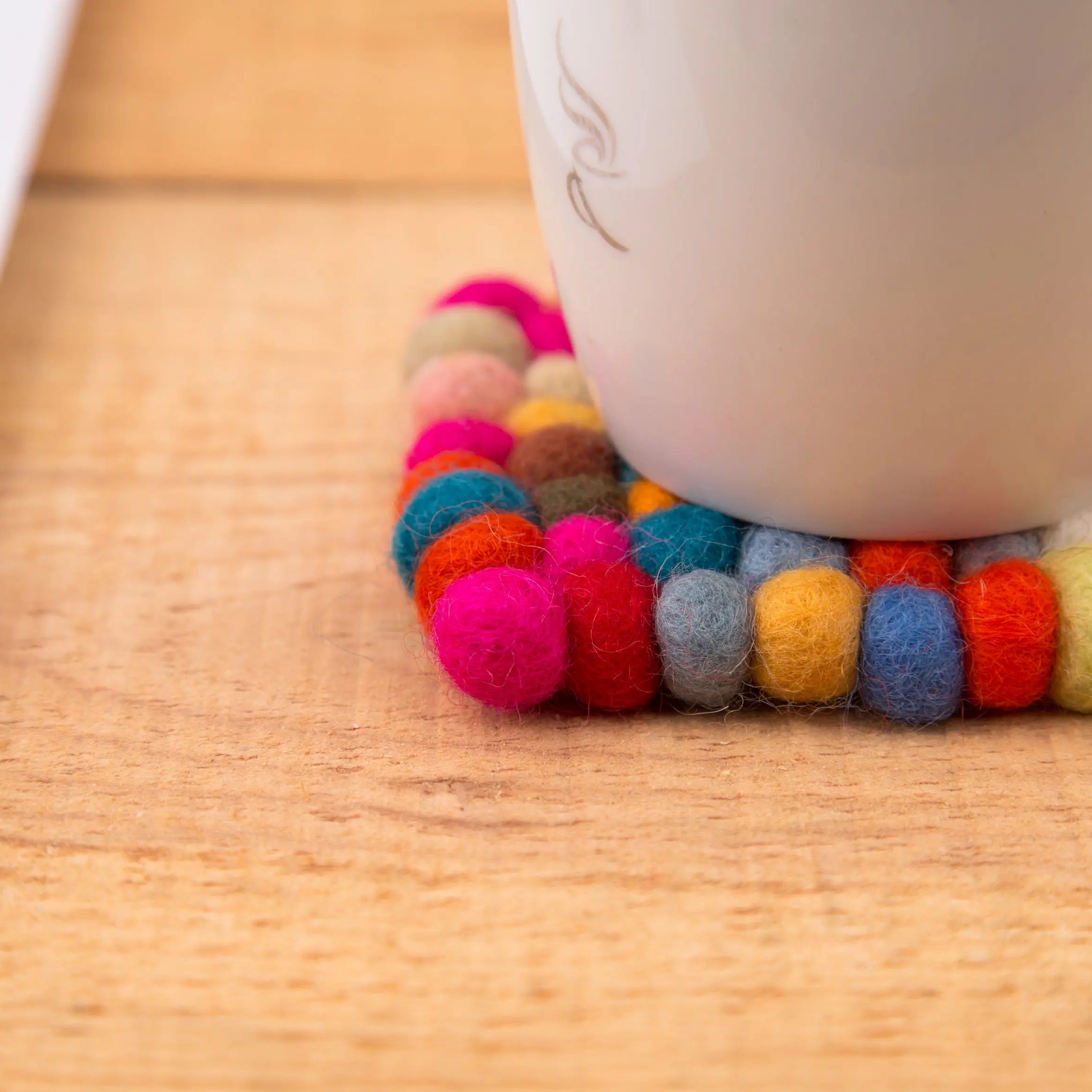 Elevate Your Table Decor with Handcrafted Wool Felt Ball Mats from Nepal – The Perfect Tea Coasters Best Himalaya