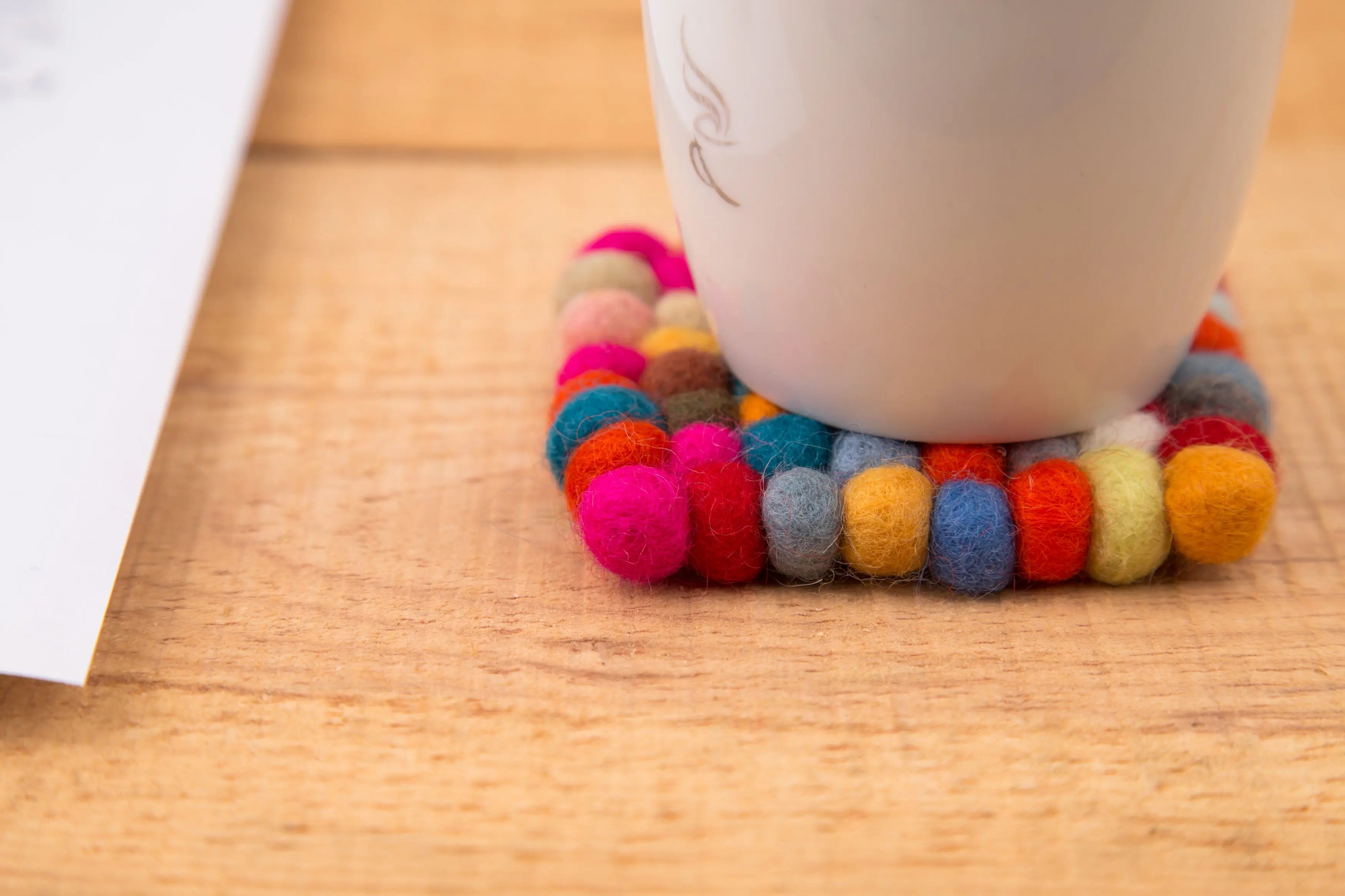 Elevate Your Table Decor with Handcrafted Wool Felt Ball Mats from Nepal – The Perfect Tea Coasters Best Himalaya