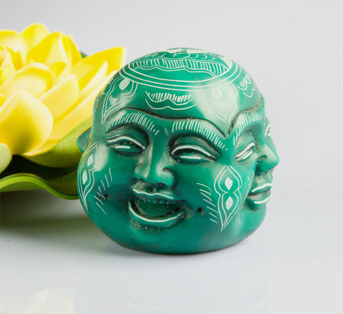 Four faces of buddha resin statue